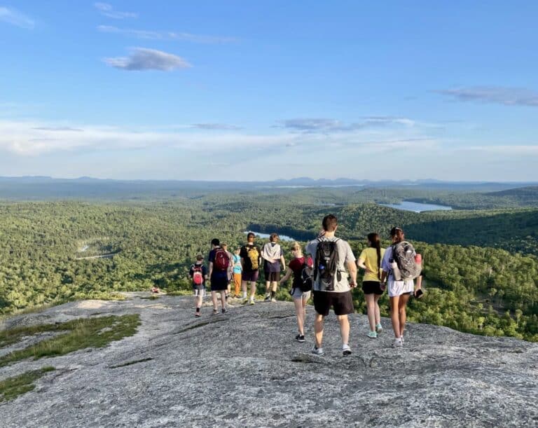 Students walk on top of mountain