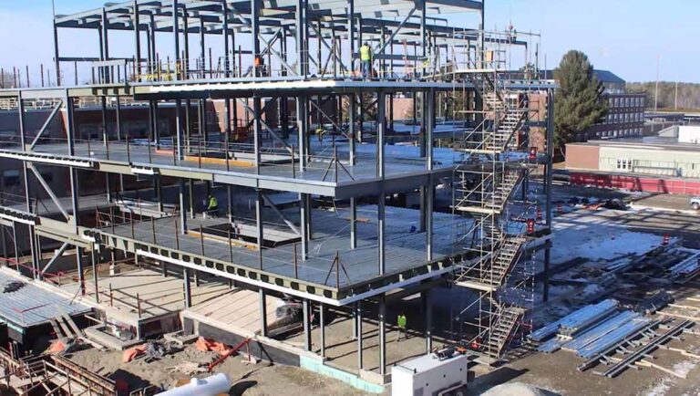 Installation of final beam, time capsule highlight UMaine Ferland Engineering Education and Design Center ceremony